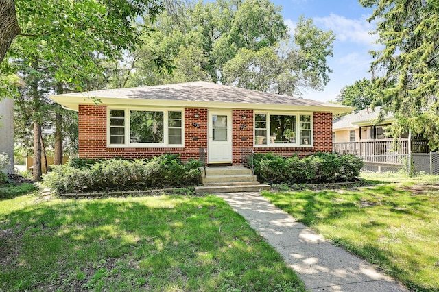 5030 Sheridan Ave S, Minneapolis, MN 55410 - view of front of home with a front yard and brick siding