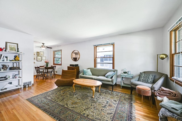 5030 Sheridan Ave S, Minneapolis, MN 55410 - living area featuring plenty of natural light, wood finished floors, and a ceiling fan