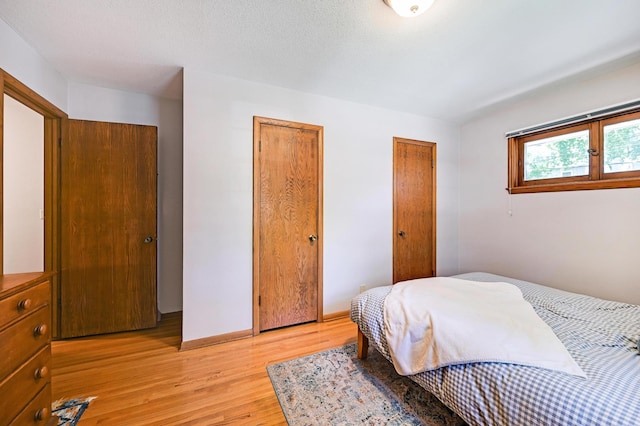 5030 Sheridan Ave S, Minneapolis, MN 55410 - bedroom with two closets and light wood-type flooring