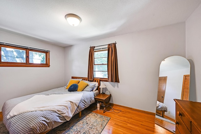 5030 Sheridan Ave S, Minneapolis, MN 55410 - bedroom with wood finished floors and arched walkways