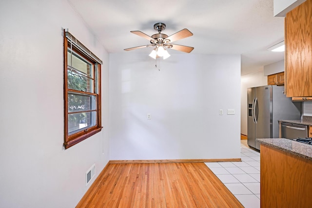 5030 Sheridan Ave S, Minneapolis, MN 55410 - unfurnished dining area featuring ceiling fan and light wood-type flooring