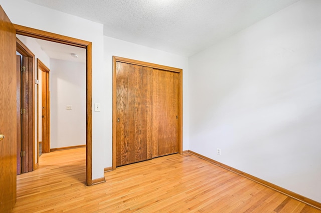 5030 Sheridan Ave S, Minneapolis, MN 55410 - unfurnished bedroom featuring light wood-style flooring and a closet