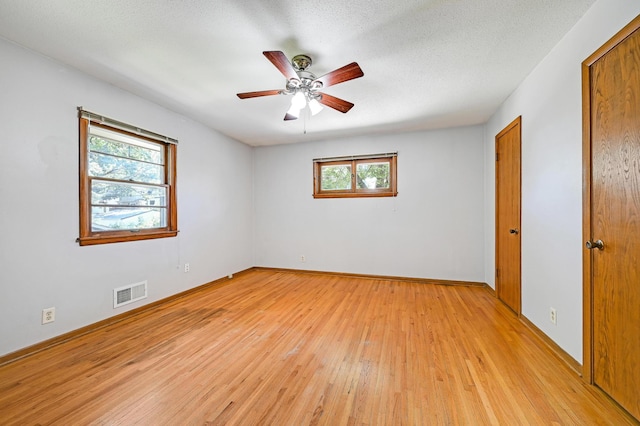 5030 Sheridan Ave S, Minneapolis, MN 55410 - unfurnished room with plenty of natural light, light wood-style floors, and a ceiling fan