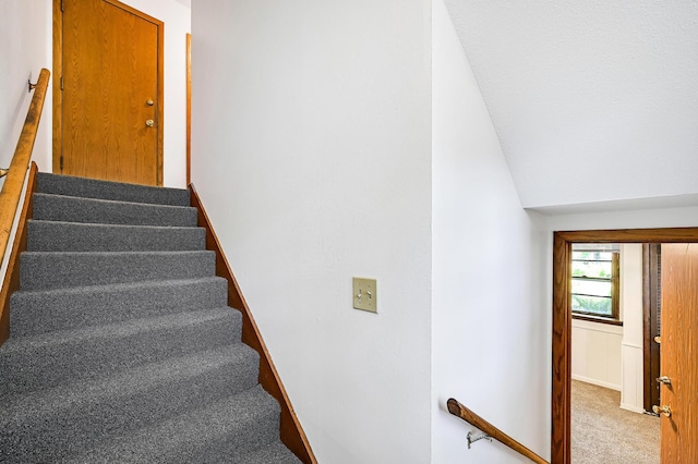 5030 Sheridan Ave S, Minneapolis, MN 55410 - staircase with carpet flooring and lofted ceiling