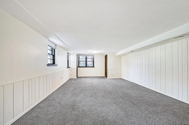 5030 Sheridan Ave S, Minneapolis, MN 55410 - spare room featuring a textured ceiling and carpet flooring