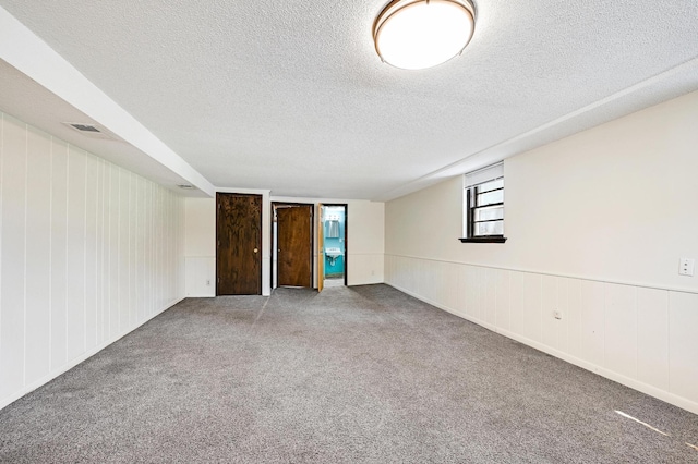 5030 Sheridan Ave S, Minneapolis, MN 55410 - carpeted empty room featuring a textured ceiling