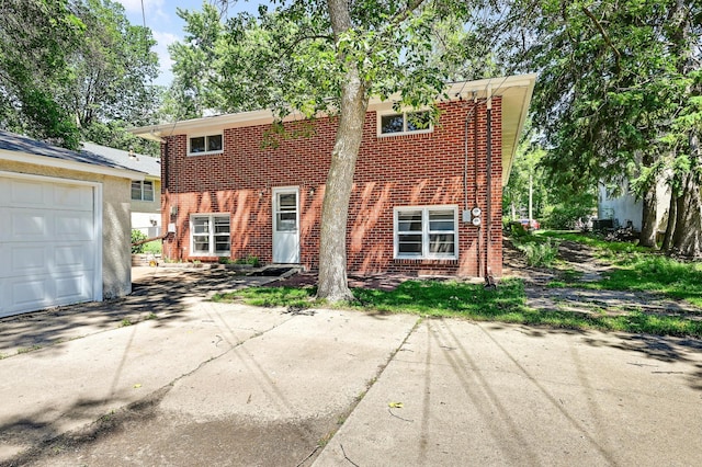 5030 Sheridan Ave S, Minneapolis, MN 55410 - view of front of home featuring brick siding and driveway