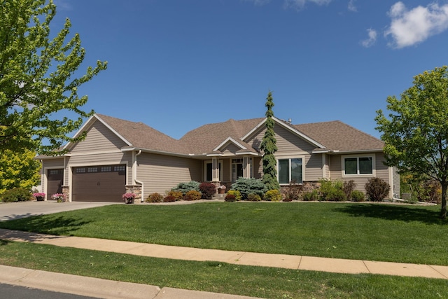 1121 Maplebeck Enclave NE, Byron, MN 55920 - view of front of house with a garage, a front lawn, stone siding, and driveway