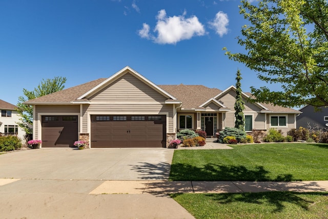 1121 Maplebeck Enclave NE, Byron, MN 55920 - craftsman house with an attached garage, concrete driveway, a front lawn, stone siding, and roof with shingles