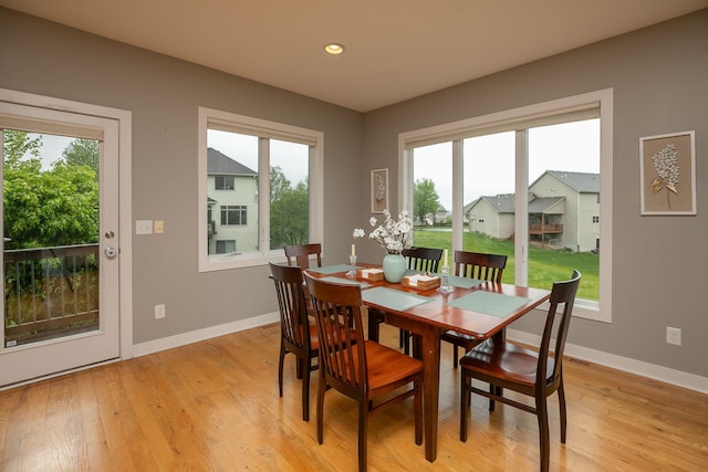 1121 Maplebeck Enclave NE, Byron, MN 55920 - dining space with baseboards, light wood-style floors, and recessed lighting