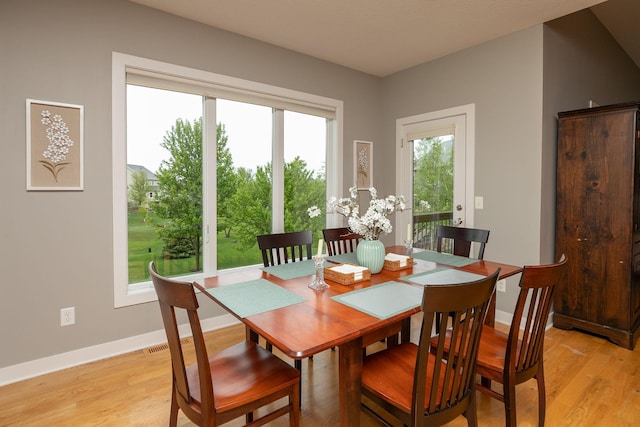 1121 Maplebeck Enclave NE, Byron, MN 55920 - dining space featuring plenty of natural light, light wood-type flooring, and baseboards