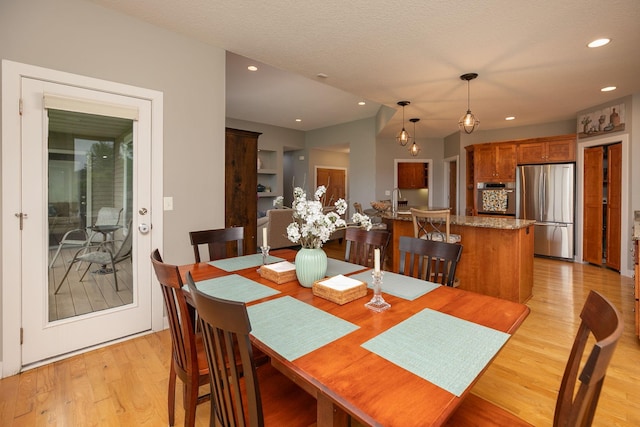 1121 Maplebeck Enclave NE, Byron, MN 55920 - dining area featuring light wood-style flooring and recessed lighting