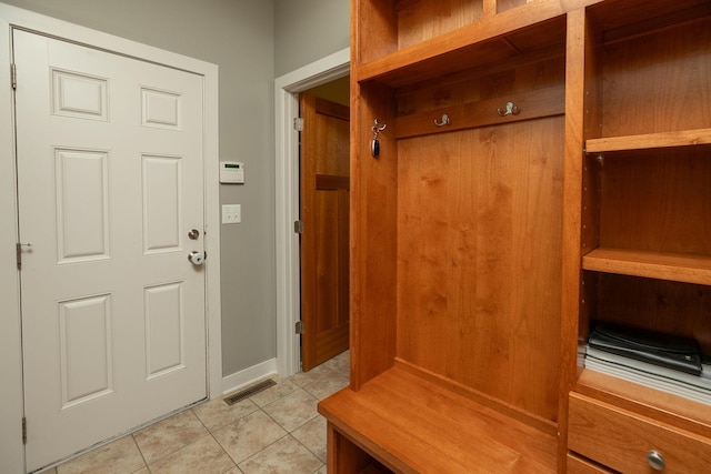 1121 Maplebeck Enclave NE, Byron, MN 55920 - mudroom with light tile patterned flooring and baseboards