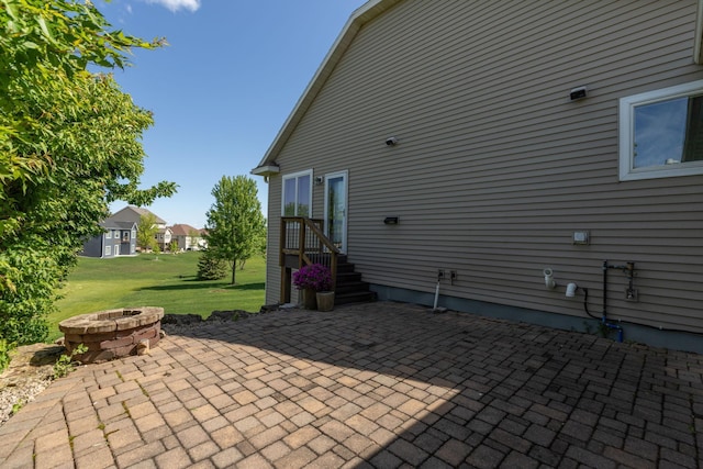 1121 Maplebeck Enclave NE, Byron, MN 55920 - view of patio / terrace featuring an outdoor fire pit