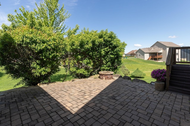 1121 Maplebeck Enclave NE, Byron, MN 55920 - view of patio with an outdoor fire pit
