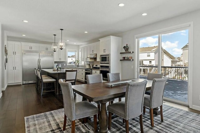 11686 32nd St N, Lake Elmo, MN 55042 - dining space featuring dark wood-style flooring, recessed lighting, and baseboards