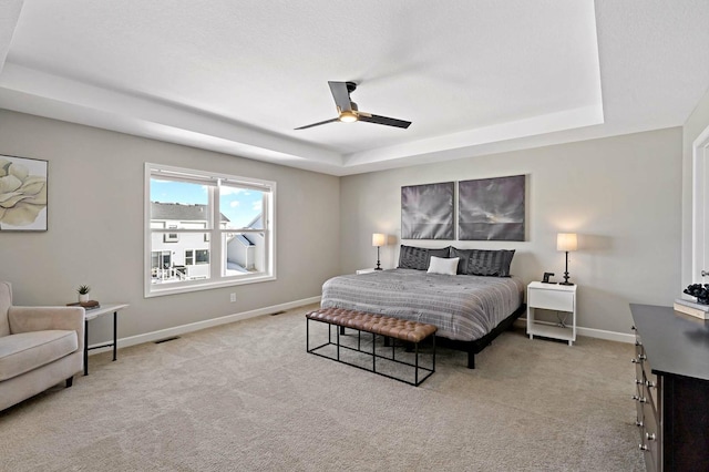 11686 32nd St N, Lake Elmo, MN 55042 - bedroom with a raised ceiling, light colored carpet, and baseboards