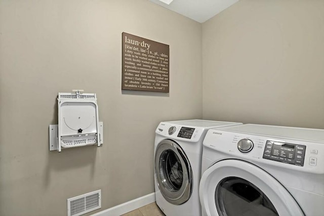 11686 32nd St N, Lake Elmo, MN 55042 - laundry room with independent washer and dryer, baseboards, and light tile patterned flooring