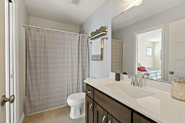 11686 32nd St N, Lake Elmo, MN 55042 - bathroom with toilet, vanity, tile patterned flooring, and curtained shower