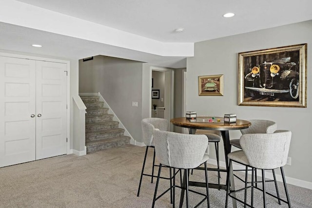 11686 32nd St N, Lake Elmo, MN 55042 - dining room with carpet floors, baseboards, stairs, and recessed lighting