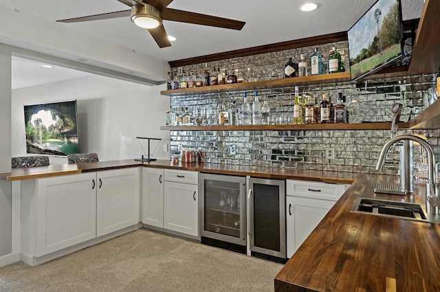 11686 32nd St N, Lake Elmo, MN 55042 - indoor wet bar featuring wine cooler, ceiling fan, light carpet, and recessed lighting