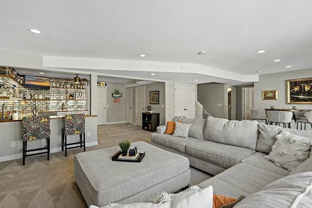 11686 32nd St N, Lake Elmo, MN 55042 - carpeted living area with stairway, wet bar, recessed lighting, and baseboards