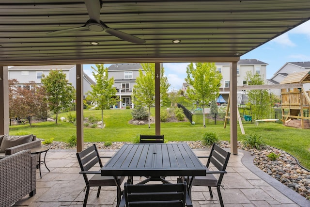 11686 32nd St N, Lake Elmo, MN 55042 - view of patio with outdoor dining area, a ceiling fan, and a playground