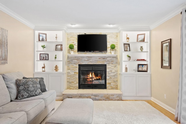 11422 71st Ave N, Maple Grove, MN 55369 - living room featuring a stone fireplace, wood finished floors, crown molding, baseboards, and built in shelves