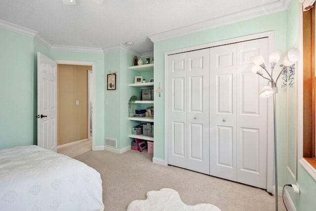 11422 71st Ave N, Maple Grove, MN 55369 - bedroom with crown molding, light colored carpet, a closet, and baseboards