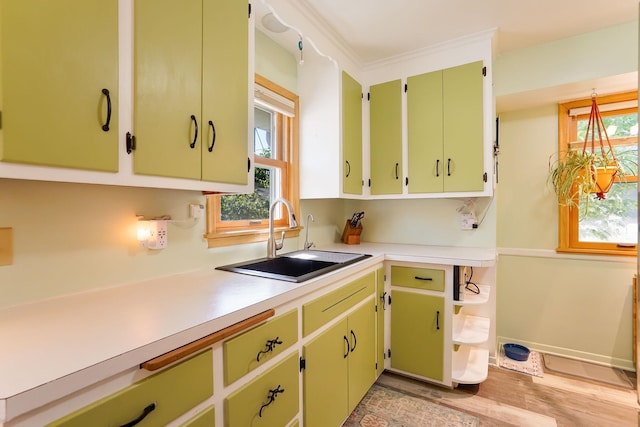 4845 15th Ave S, Minneapolis, MN 55417 - kitchen featuring a sink, light countertops, and light wood-style floors