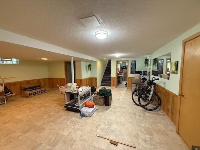 4845 15th Ave S, Minneapolis, MN 55417 - finished below grade area featuring a wainscoted wall, wooden walls, a textured ceiling, and stairway