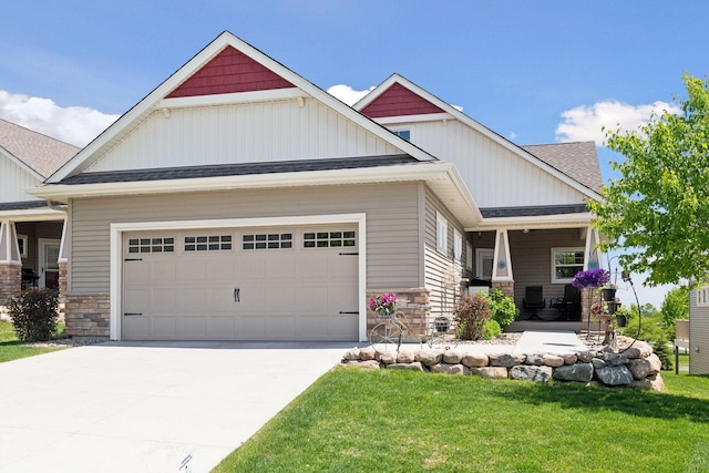 525 Roanoke Ct, Waconia, MN 55387 - craftsman-style house with stone siding, an attached garage, and concrete driveway