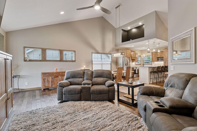 525 Roanoke Ct, Waconia, MN 55387 - living area featuring high vaulted ceiling, a ceiling fan, hardwood / wood-style floors, baseboards, and recessed lighting