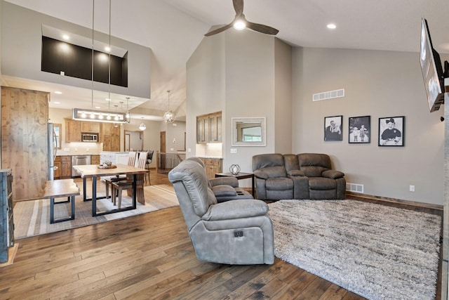 525 Roanoke Ct, Waconia, MN 55387 - living room with a ceiling fan, hardwood / wood-style flooring, high vaulted ceiling, and baseboards