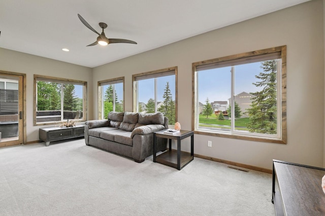525 Roanoke Ct, Waconia, MN 55387 - living room with light carpet, ceiling fan, baseboards, and recessed lighting