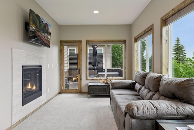 525 Roanoke Ct, Waconia, MN 55387 - living room featuring light colored carpet, a tile fireplace, recessed lighting, and baseboards