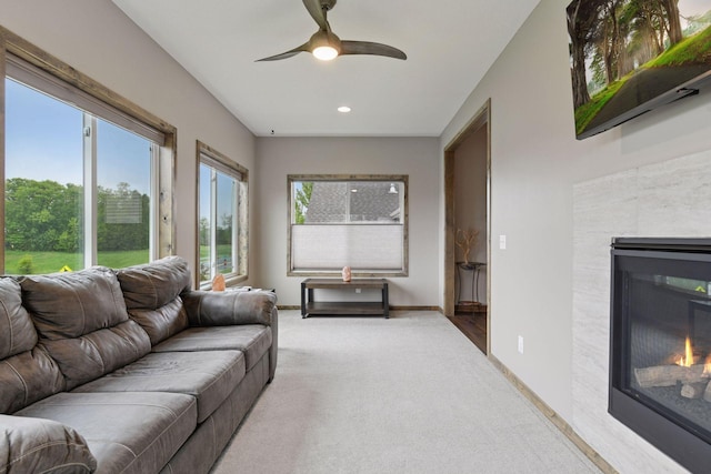 525 Roanoke Ct, Waconia, MN 55387 - living room with a glass covered fireplace, carpet, a ceiling fan, recessed lighting, and baseboards