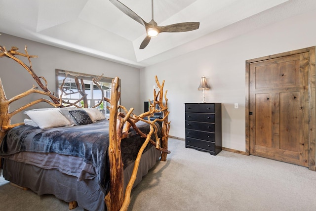525 Roanoke Ct, Waconia, MN 55387 - carpeted bedroom with a tray ceiling, baseboards, and a ceiling fan