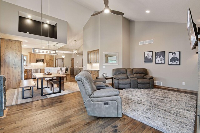 525 Roanoke Ct, Waconia, MN 55387 - living area with a ceiling fan, wood finished floors, high vaulted ceiling, and recessed lighting