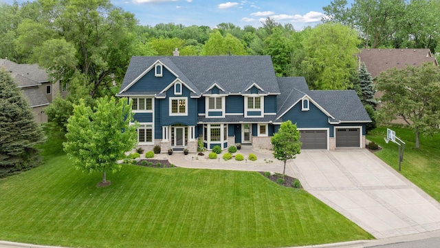 18172 Tamarack Dr, Minnetonka, MN 55345 - craftsman-style home with an attached garage, concrete driveway, a front lawn, and a chimney