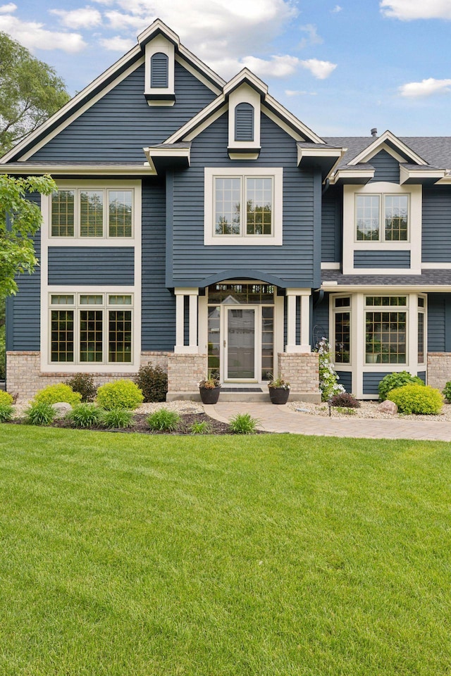 18172 Tamarack Dr, Minnetonka, MN 55345 - view of front of house with brick siding and a front lawn