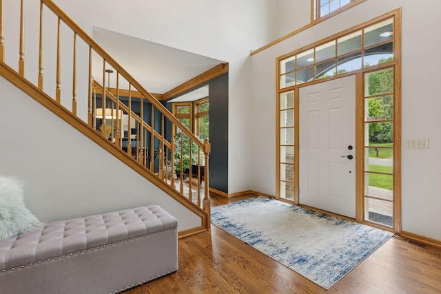 18172 Tamarack Dr, Minnetonka, MN 55345 - foyer entrance with wood finished floors, baseboards, and stairway