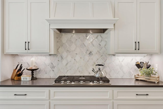 18172 Tamarack Dr, Minnetonka, MN 55345 - kitchen with stainless steel gas stovetop, dark countertops, decorative backsplash, and custom range hood