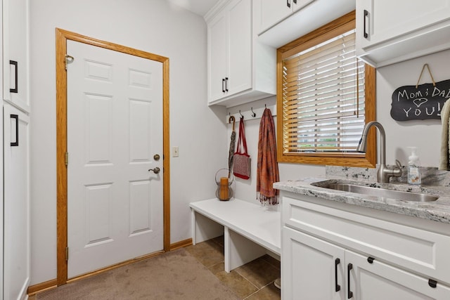 18172 Tamarack Dr, Minnetonka, MN 55345 - mudroom with a sink, baseboards, and light tile patterned floors