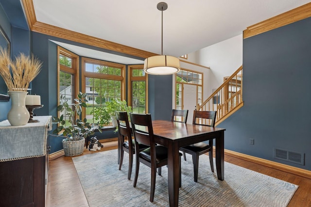 18172 Tamarack Dr, Minnetonka, MN 55345 - dining room featuring plenty of natural light, baseboards, stairway, and wood finished floors
