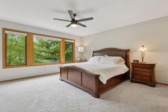 18172 Tamarack Dr, Minnetonka, MN 55345 - carpeted bedroom featuring multiple windows, baseboards, and a ceiling fan