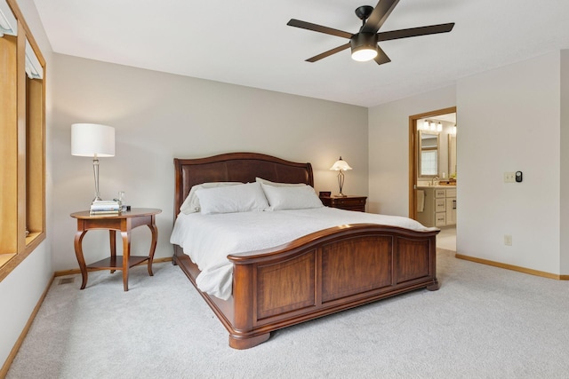 18172 Tamarack Dr, Minnetonka, MN 55345 - bedroom with light colored carpet, baseboards, and ensuite bathroom