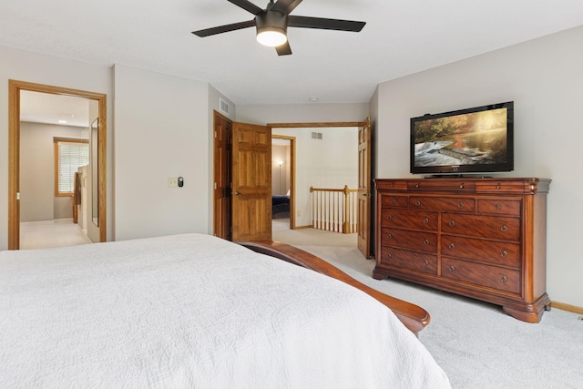 18172 Tamarack Dr, Minnetonka, MN 55345 - bedroom with carpet floors, baseboards, a ceiling fan, and connected bathroom