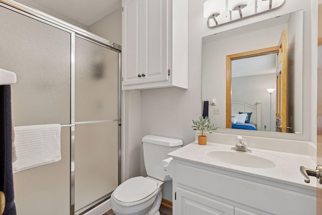 18172 Tamarack Dr, Minnetonka, MN 55345 - full bathroom featuring connected bathroom, vanity, a shower stall, and toilet