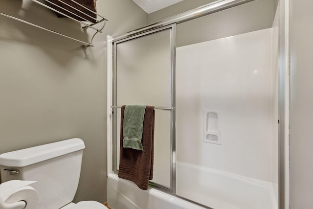 18172 Tamarack Dr, Minnetonka, MN 55345 - bathroom with shower / bath combination with glass door and toilet